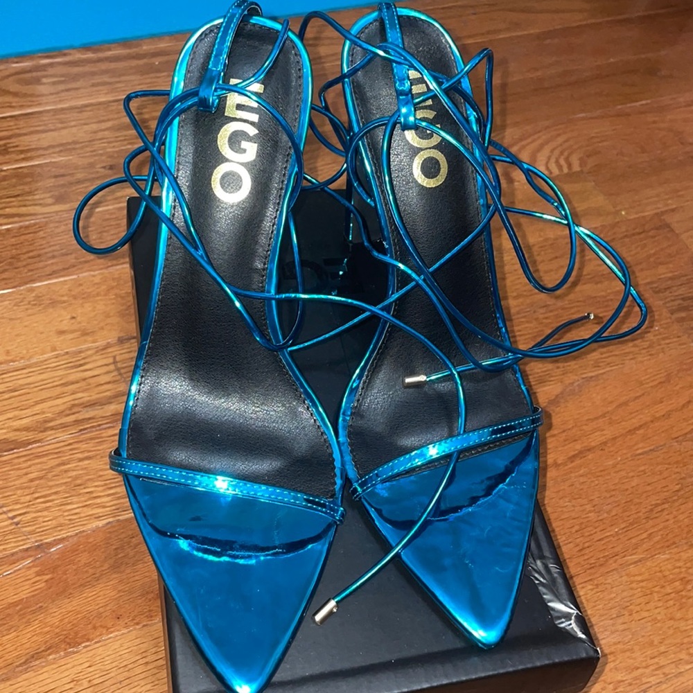 Metallic blue lace up heels